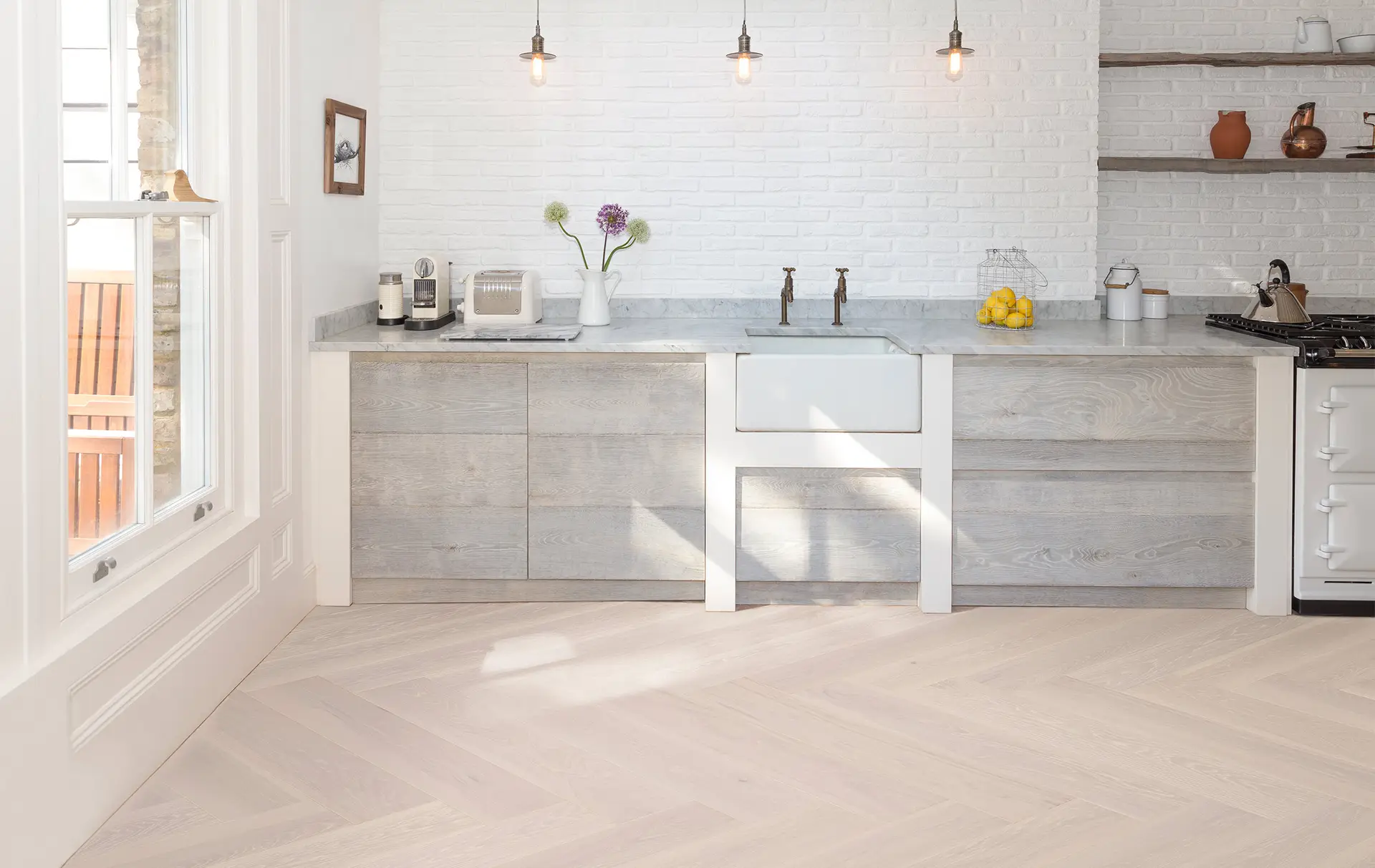https://urbanwoodfloor.com/wp-content/uploads/2025/04/Evora-Herringbone-Hickory-kitchen-straight.webp