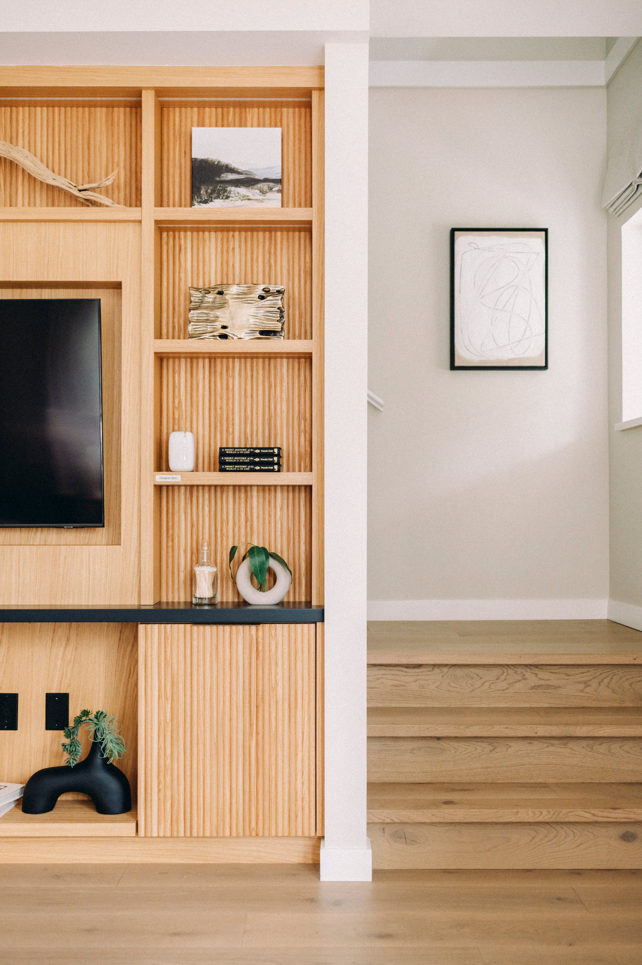 https://urbanwoodfloor.com/wp-content/uploads/2025/05/Leah-FortLangley-UW-Yaletown-Living-to-Stairs-transition.jpg
